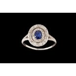 A SAPPHIRE AND DIAMOND OVAL CLUSTER RING, c.1920's