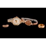 A LADIES VINTAGE OMEGA WATCH HEAD; together with another gold watch head, an 18ct gold band ring,