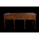 A GEORGE II OAK RECTANGULAR SIDE BOARD, with later decoration fitted three drawers,