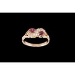 AN EARLY 20TH CENTURY RUBY AND DIAMOND DRESS RING, with rubies of approx 0.