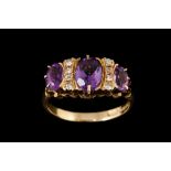 AN AMETHYST AND DIAMOND RING,