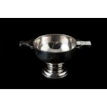 A MODERN SILVER TRIM HANDLED QUAICH,