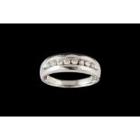 A DIAMOND HALF ETERNITY RING, mounted in 14ct white gold, finger size V.