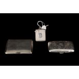 AN EDWARDIAN SILVER VESTA BOX, Chester 1902, together with two silver cigarette cases,