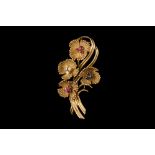 A MID 20TH CENTURY FLORAL SPRAY BROOCH, set with sapphire, ruby and diamonds,