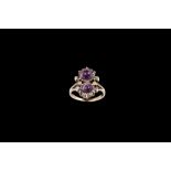 AN EDWARDIAN AMETHYST AND DIAMOND DOUBLE CLUSTER RING,