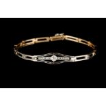 AN EARLY 20TH CENTURY BRACELET WITH DIAMOND CENTREPIECE, in platinum topped 14ct gold,
