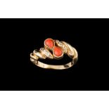 A CORAL AND DIAMOND SET DRESS RING, mounted in 18ct yellow gold,