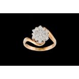 A DIAMOND CLUSTER RING,