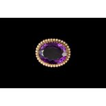 AN OVAL AMETHYST AND CULTURED PEARL BROOCH