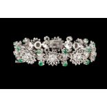 A DIAMOND AND EMERALD BRACELET,