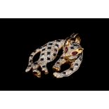 A SAPPHIRE AND DIAMOND PENDANT/BROOCH, in the form of a leopard,