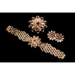 A RUBY AND DIAMOND FLORAL MOTIF SUITE, comprising of a flexible bracelet,