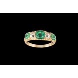 A VICTORIAN EMERALD AND DIAMOND CARVED DRESS RING, with emeralds of approx 1.47ct and diamonds of
