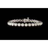 A DIAMOND LINE BRACELET, with collet set diamonds of approx. 8.