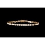 A DIAMOND LINE BRACELET, with diamonds of approx 7.20ct in total, mounted in 18ct gold.