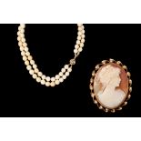 A TWO ROW BEADED NECKLACE; together with a cameo brooch,