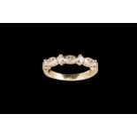 A DIAMOND HALF ETERNITY RING, with pear shaped diamonds,