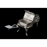 A NOVELTY CONTINENTAL SILVER VESTA, in the form of a piano, c.