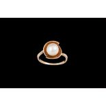 A PEARL SET RING,