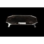 A MODERN ROYAL IRISH SILVER RECTANGULAR TEAPOT STAND, with canted corners, raised on four feet,