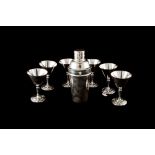 A SET OF SIX SILVER PLATED COCKTAIL GLASSES, with silver plated cocktail shaker,