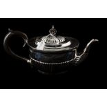 A VICTORIAN SILVER TEAPOT, with gadrooned decoration,