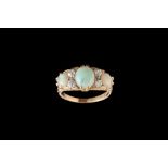 A VICTORIAN OPAL AND DIAMOND CARVED DRESS RING, with diamonds of approx 0.