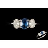 A SAPPHIRE AND DIAMOND THREE STONE RING, with sapphire of approx. 1.05ct, diamonds of approx. 0.