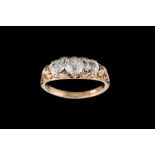 A LATE VICTORIAN DIAMOND CARVED THREE STONE RING, with diamonds of approx 1.