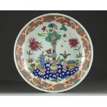 A Chinese famille rose 'precious objects' charger