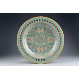 A large Chinese turquoise-ground famille rose 'birthday' dish