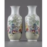 A pair of Chinese famille rose 'boys' vases