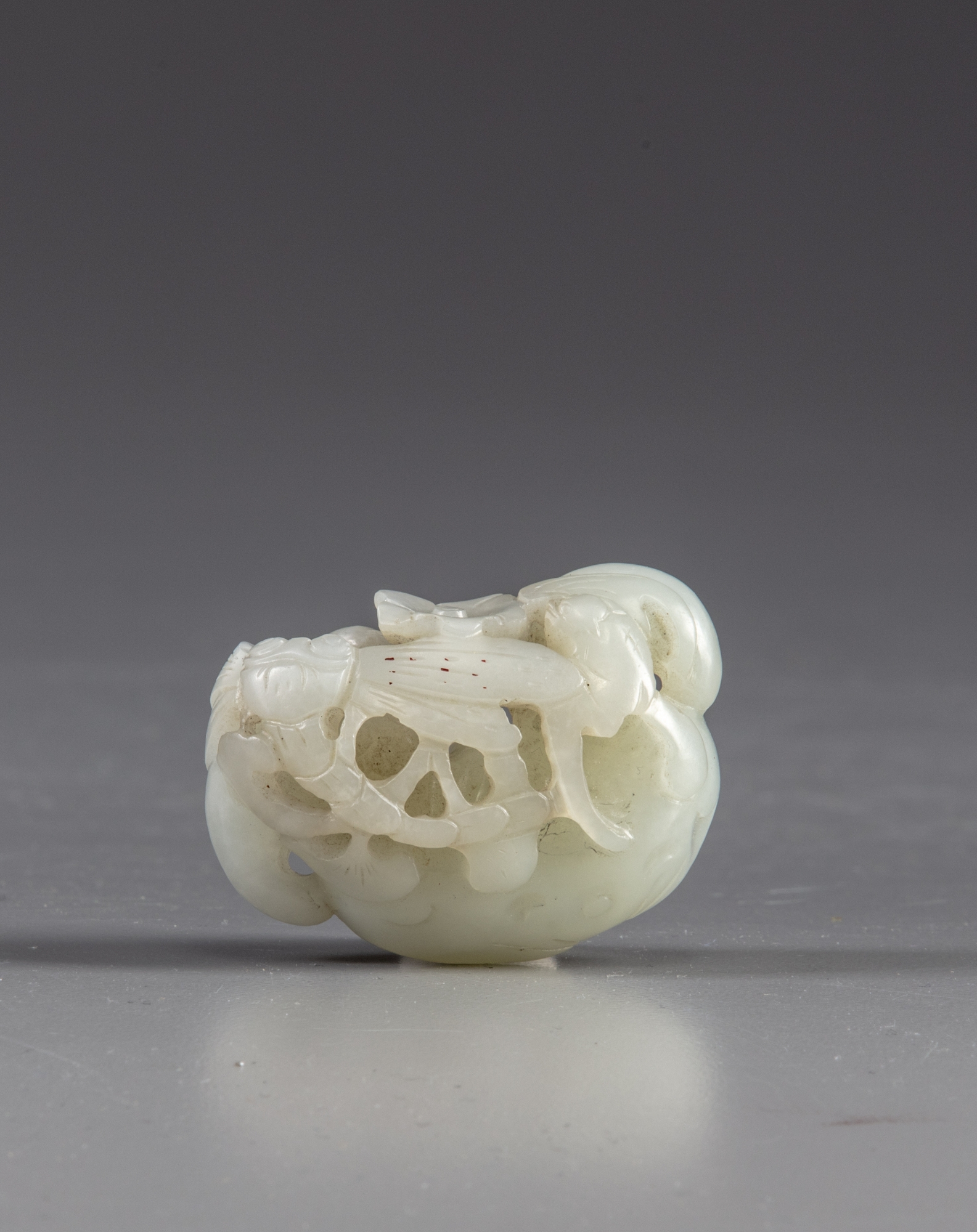 A Chinese white jade carving of a water caltrop