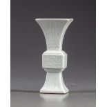 A small Chinese white- glazed gu vase