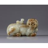 A Chinese celadon and russet jade Buddhist lion water dropper