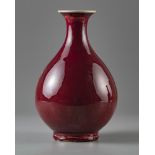 A red glazed pear shaped vase 'yuhuchunping'