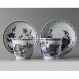 A pair of Chinese blue and white ‘peony’ cups and saucers