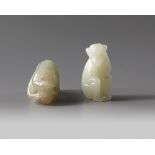 Two Chinese celadon and pale celadon jade monkeys