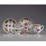 Two pairs of famille rose cups and saucers