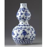 A Chinese blue and white double gourd vase