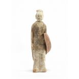 A Chinese painted pottery model of a standing warrior