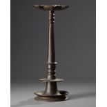 An Islamic bronze lamp-stand