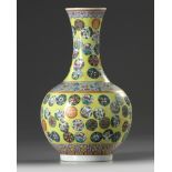 A Chinese yellow ground famille rose 'flower roundel' vase