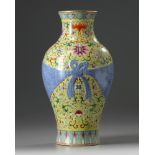 A Chinese yellow-ground famille rose trompe l’oeil vase