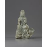 A celadon jade carving of a guanyin