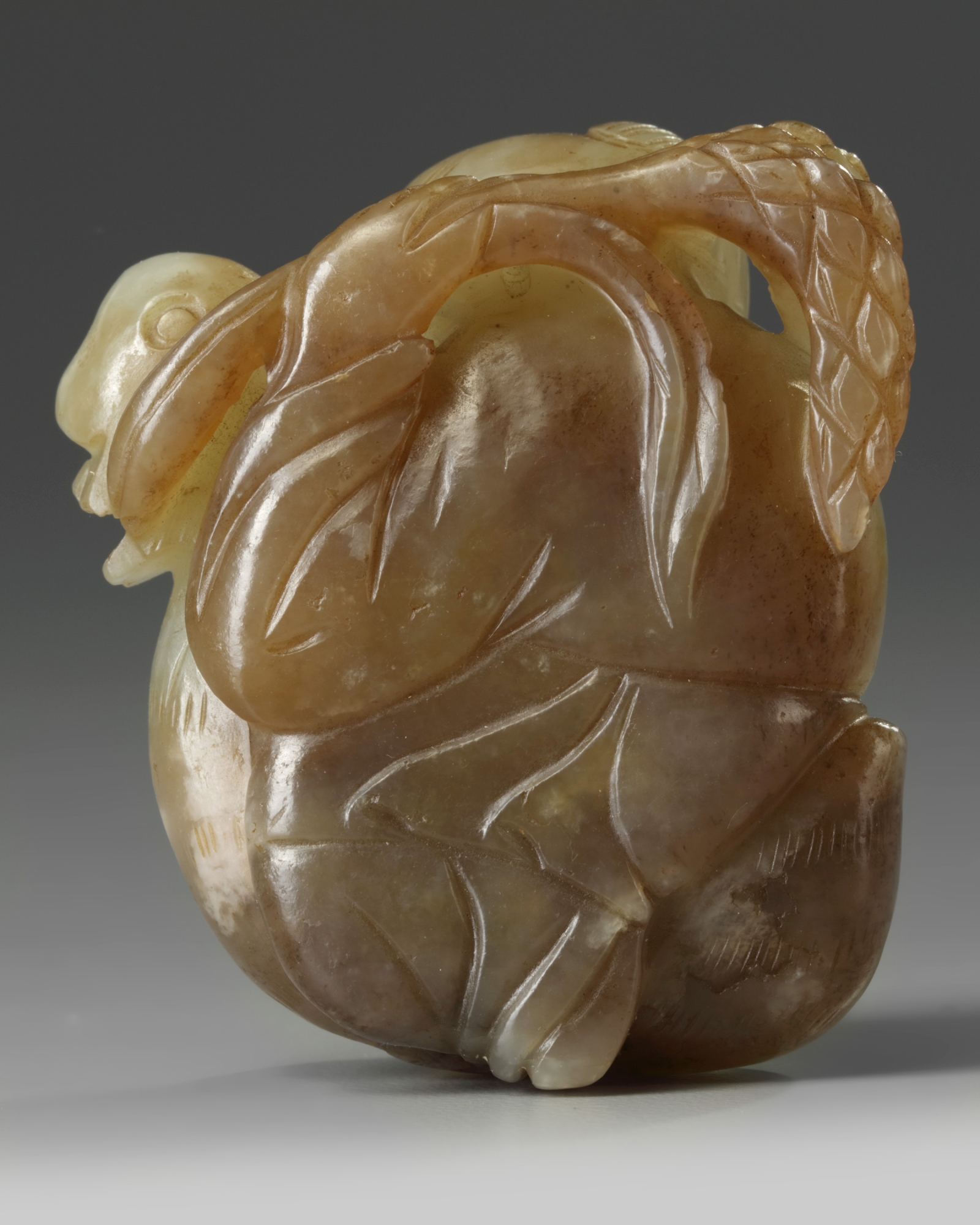 A Chinese celadon and russet jade 'boy and goose' carving - Image 2 of 2