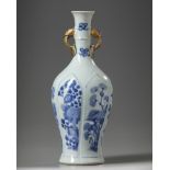 A Chinese blue and white twin-handled slender vase