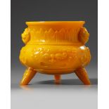 A Chinese opaque yellow glass tripod censer