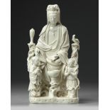 A Chinese Dehua white-glazed Guanyin group